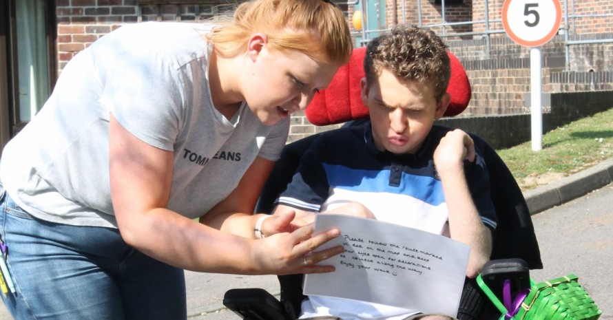 young man with support worker interacting
